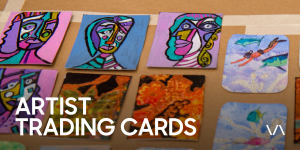 Eight colourful artist trading cards displayed on a brown surface. 