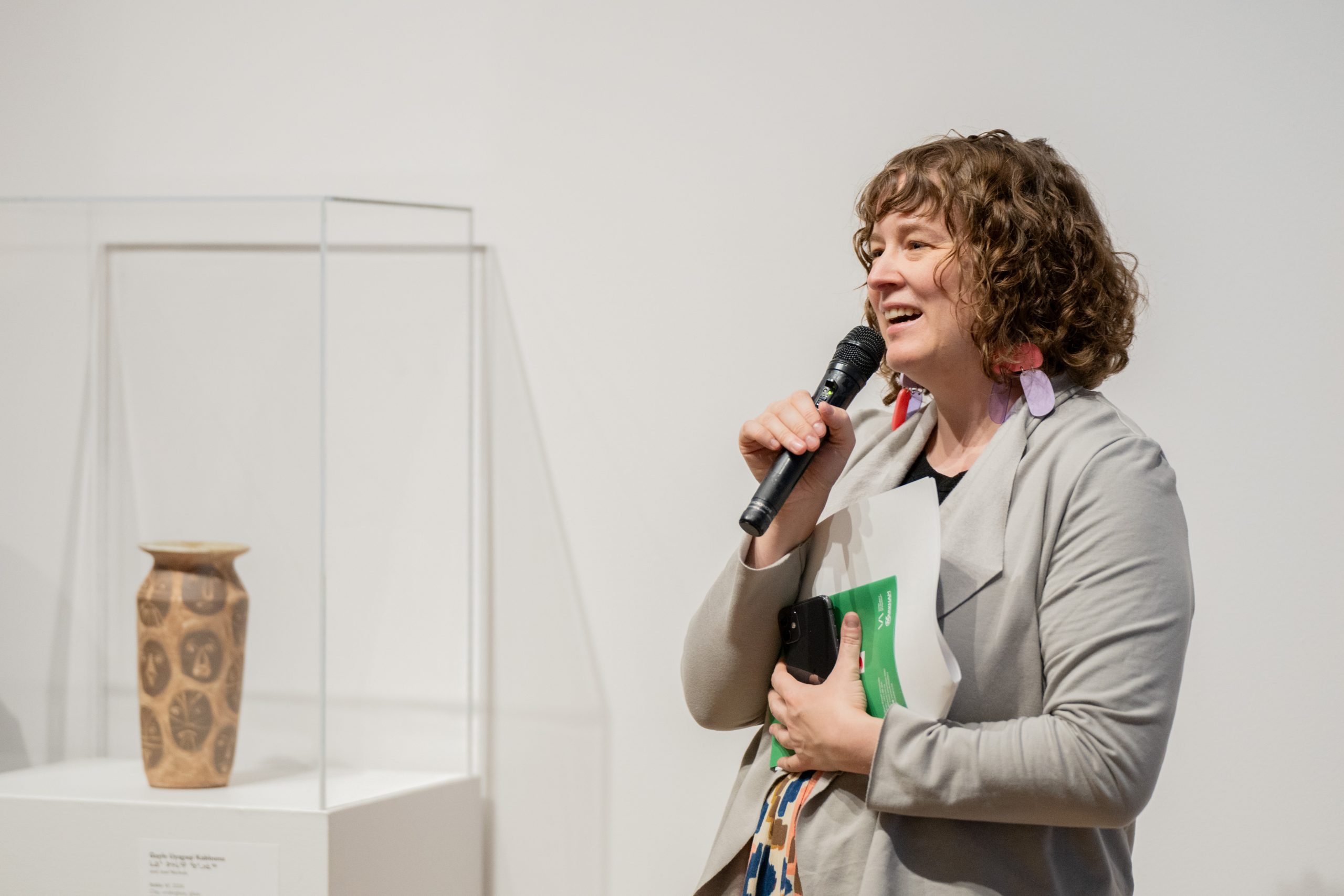 Varley Art Gallery curator, Anik Glaude, is giving a talk in the exhibition space.