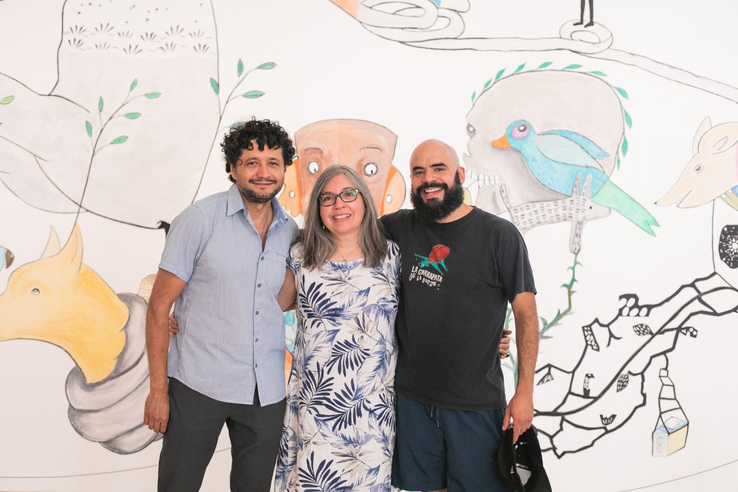 Promotional banner of event "Lunch and Learn with Z’otz* Collective" at the Varley Art Gallery of Markham, featuring the Z'otz* Collective standing in front of their mural artwork in the background