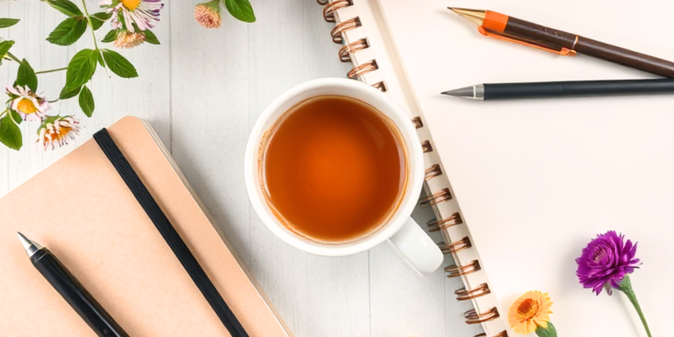 Promotional banner of event "Chai and Write" at the Varley Art Gallery of Markham, featuring a cup of Chai tea, some journals, pens, and plant samples in the background.